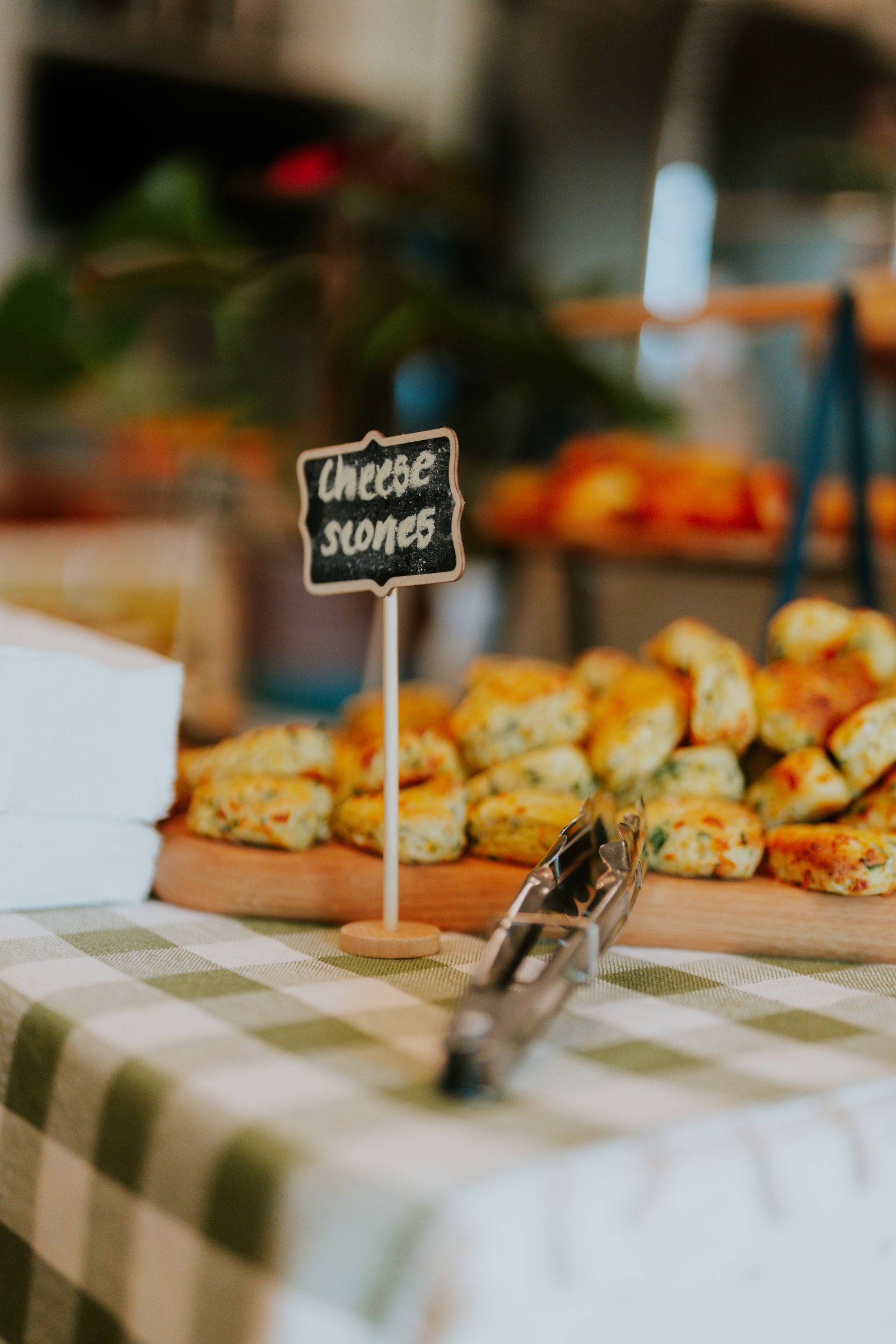Cheese scones on a table with a handwritten label